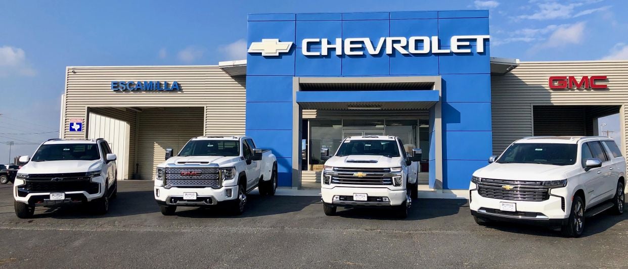 The front view of the Escamilla Chevrolet GMC building in Hebbronville TX with cars parked in front of it
